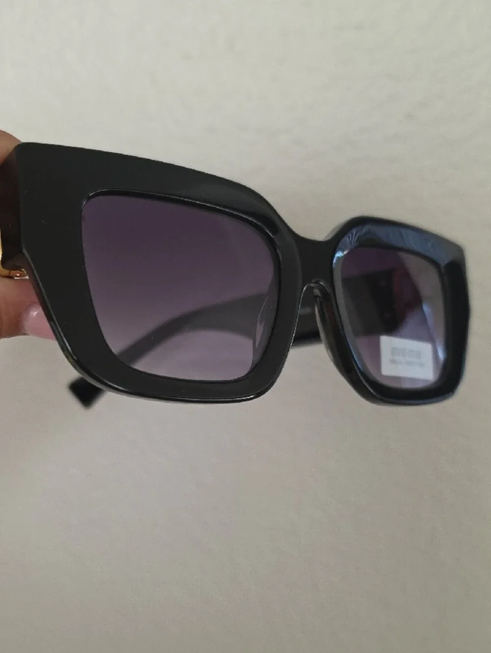 Miu Miu Glossy Black Frame Sunglasses with Purple Lenses